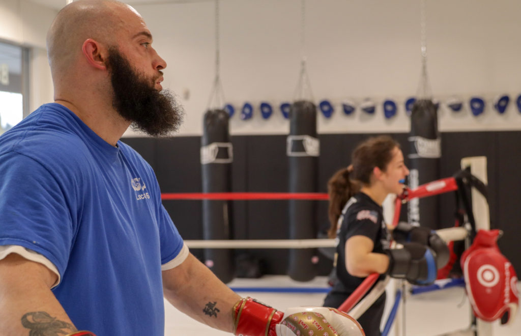 Two Students Listening to Boxing Instruction